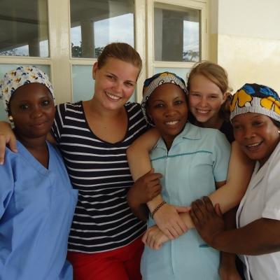Local doctors and nurses posing with a Projects Abroad Midwifery intership student in Tanzania. Gain midwifery work experience whilst on an internship with Projects Abroad and assist and learn from local doctors.